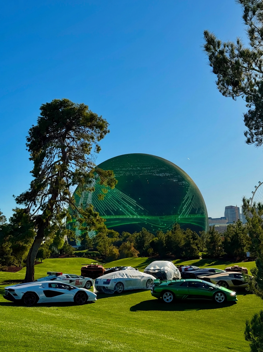 Concours d'elegance car show on a Las Vegas golf course with the Sphere glowing in the background